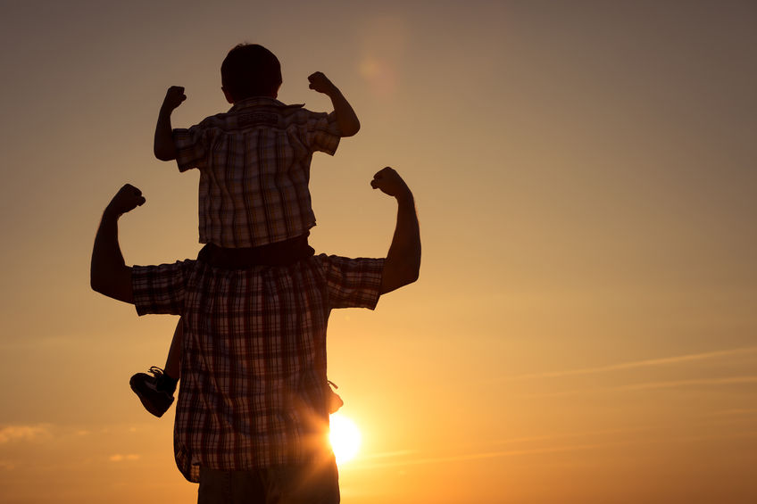 Finding Your Strengths in Mentoring 5 Father and son walking on the field at the sunset time. concept of family strength