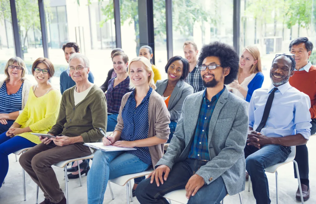 Keys to Creating a Mentoring Culture 7 Multi-ethnic group of mentors and mentees in seminar