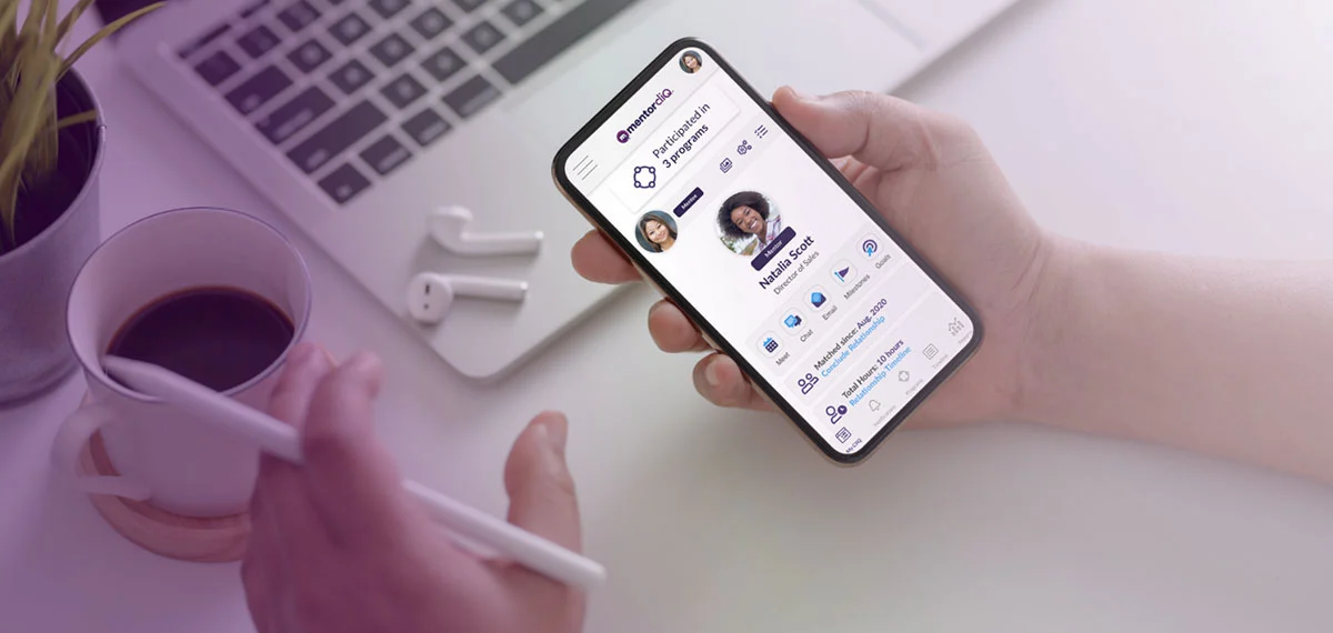 Virtual Mentoring 2 Hand holding smartphone with the MentorcliQ app