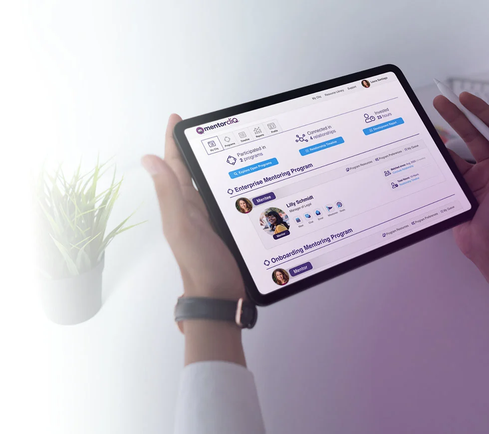 Virtual Mentoring 5 Hand holding tablet with the MentorcliQ app