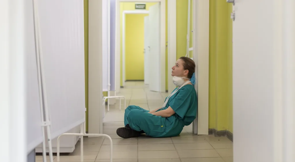 Mentorship Programs: Top 5 Questions Answered 10 Tired nurse sitting on the floor turnover