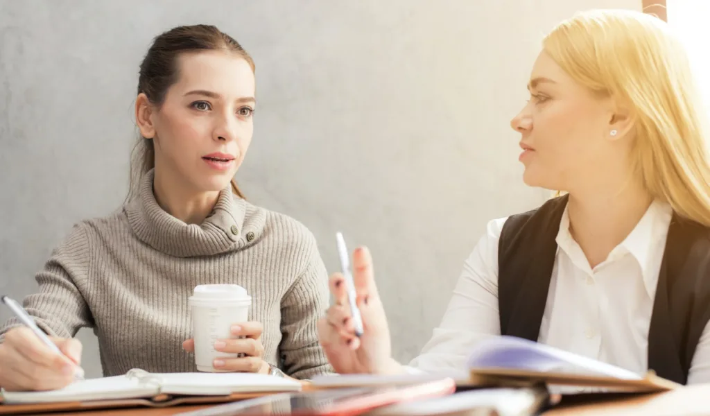 Gain Soft Skills While Mentoring 4 Women chatting using soft skills while mentoring.