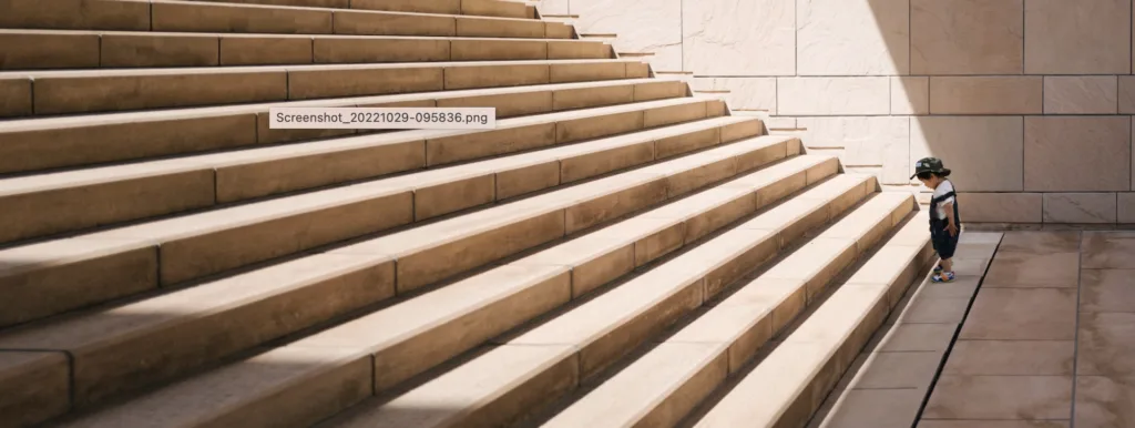 What Are Long-Term Goals? Examples and Goal-Setting Ideas 12 Baby looking at steps and setting goals.