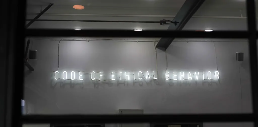 Team Culture: Strategies to Build a Strong Team 11 Image of a sign that reads, code of ethical behavior.